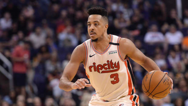 Portland Trail Blazers guard CJ McCollum dribbles against the Phoenix Suns at Talking Stick Resort Arena.